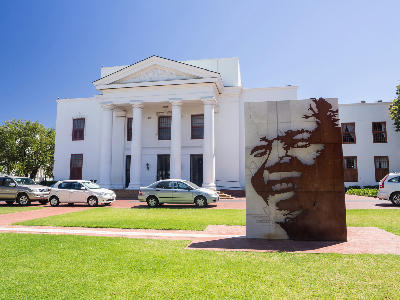 Nelson Mandela sculpture and Stellenbosch Town Hall in Stellenbosch Town Centre, Western Cape, South Africa.