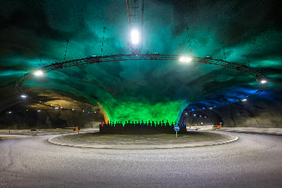Color-lit subsea roundabout inside the Eysturoy Tunnel connecting Streymoy and Eysturoy in the Faroe Islands.
