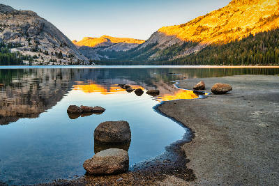 Tenaya Lake with granite peaks and sunset reflections in Yosemite National Park