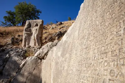 Ancient Greek inscription carved into rock beside a relief at Arsameia, Turkey.