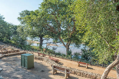 Benches and shaded viewing area at Nkuhlu Picnic Site overlooking the Sabie River in Kruger National Park.