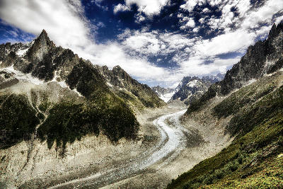 Mer de Glace glacier flowing through a rugged mountain valley in the French Alps near Chamonix.