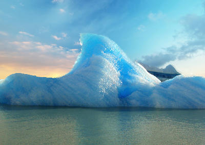 Smooth blue iceberg with curved shape floating on Lago Argentino at sunset in Patagonia, Argentina.