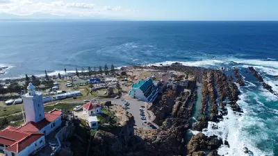 Aerial view of The Point and Cape St. Blaize Lighthouse overlooking the rocky coastline of Mossel Bay