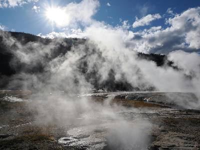 Backlit steam sunstar Black Sand Basin Yellowstone
