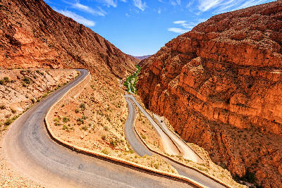 Hairpin bends of Dades Gorge Road winding through the red rock canyon landscapes of Morocco