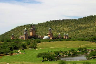 The Palace of the Lost City overlooks a lush golf course with fairways, water hazards and rolling hills at Sun City in North West Province, South Africa.