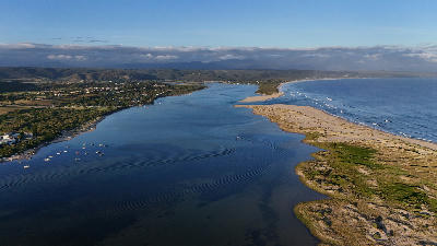 Aerial view of the Keurbooms River Mouth showing the estuary channel, sandbanks and Indian Ocean coastline near Plettenberg Bay.