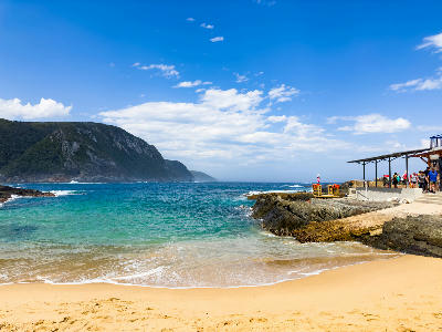 Beach and turquoise water at Storms River Mouth in Tsitsikamma National Park, South Africa.