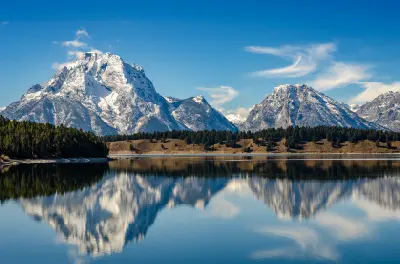 Grand Teton peaks reflected in Jenny Lake within the Alpine Lakes system in Wyoming.