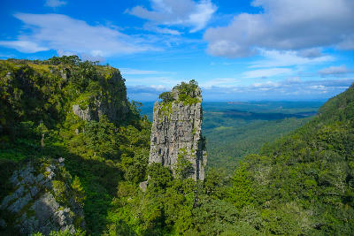 Pinnacle Rock quartzite tower rising above forested valleys and escarpment landscapes near Graskop on the Panorama Route, Mpumalanga, South Africa.