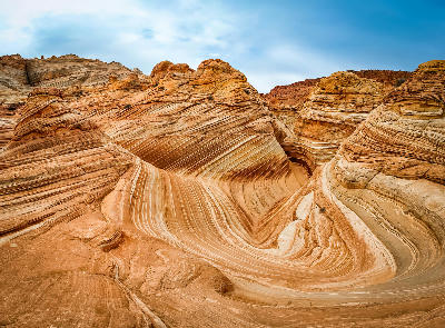 Curved layered sandstone forming The Wave in Coyote Buttes North Arizona