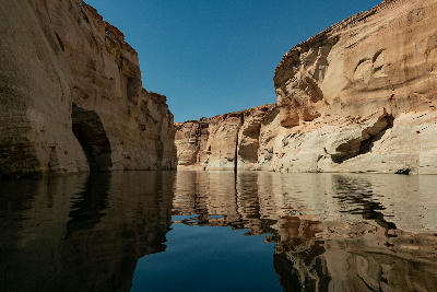 Lake Powell narrow canyon channel reflection sandstone walls Glen Canyon Arizona Utah