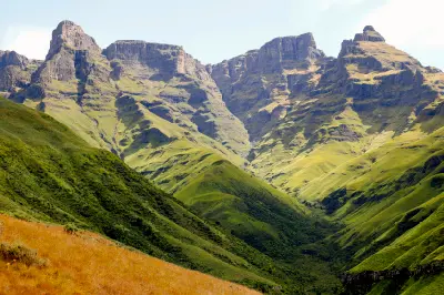 Cathedral Peak and the surrounding Drakensberg mountains above green valleys in KwaZulu-Natal, South Africa.