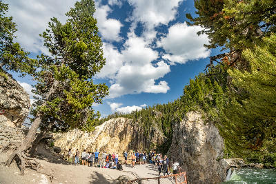 Visitors gathered at the brink of the Lower Falls viewpoint in the Grand Canyon of the Yellowstone