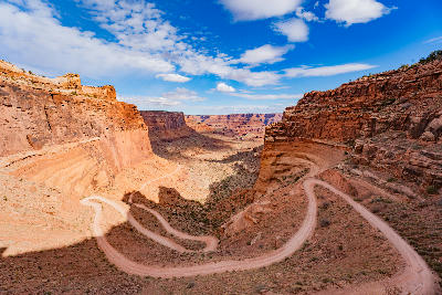 Shafer Trail switchbacks winding down steep canyon walls from Island in the Sky in Canyonlands National Park Utah