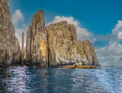 Totem Pole, Candlestick and towering dolerite sea cliffs at Cape Hauy, Tasmania.