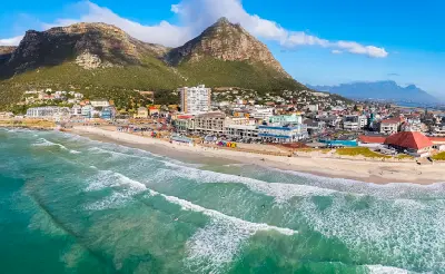 Aerial view of Muizenberg Beach and surfers in False Bay, Cape Town, South Africa.