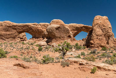 North and South Window arches with desert foreground in Arches National Park Utah
