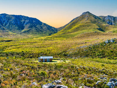 Wooden cabin in the fynbos valleys of Kogelberg Nature Reserve beneath the Hottentots-Holland Mountains in South Africa.