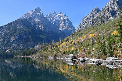 Jenny Lake with autumn foliage beneath the Grand Teton Alpine Lakes system in Wyoming.