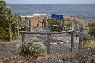 Timber lookout at Cape Leeuwin with a sign indicating the Southern Ocean and Indian Ocean.