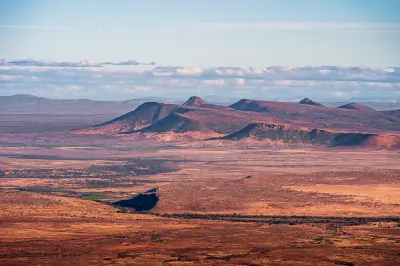 Layered Karoo mesas and flat-topped hills stretching across Camdeboo National Park near Graaff-Reinet in South Africa.