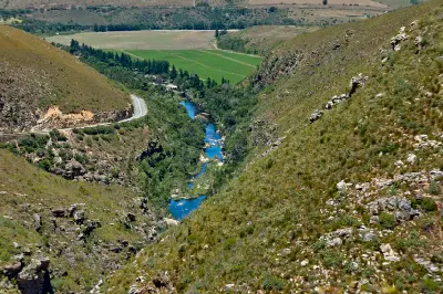 River gorge and winding road through Tradouw Pass in the Langeberg Mountains near Barrydale and Swellendam, Western Cape, South Africa.