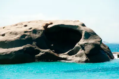 Close view of a large weathered hollow in an offshore granite rock at Twilight Beach near Esperance, Western Australia.