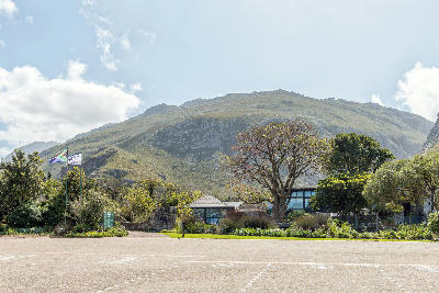 Entrance area of Harold Porter National Botanical Garden in Betty’s Bay with mountain slopes rising behind the gardens in the Western Cape, South Africa.
