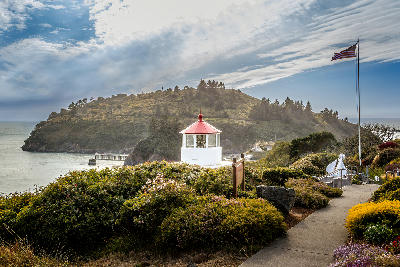 Trinidad Head lighthouse with path and coastal headland California