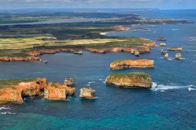 Wide elevated view of numerous limestone sea stacks, cliffs and bays at Bay of Islands on Victoria’s Great Ocean Road.