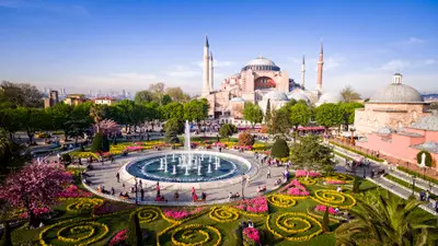 Sultanahmet Square with fountain, landscaped gardens and Hagia Sophia in the background, Istanbul, Turkey.