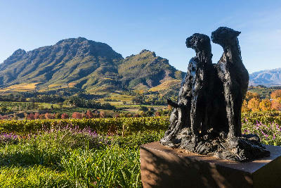 Sculpture in the gardens of Delaire Graff Estate overlooking vineyards and the Simonsberg mountains in the Cape Winelands.
