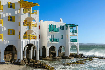 Club Mykonos resort perched above the Atlantic shoreline in Langebaan, with colourful balconies and whitewashed architecture inspired by the Greek island of Mykonos.