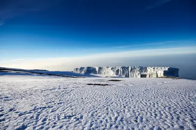 Remaining glacier near Uhuru Peak on Mount Kilimanjaro with snow-covered volcanic terrain, Tanzania.