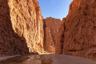 Towering canyon walls and river corridor inside Todra Gorge in Morocco