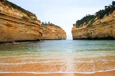 Beach-level view through the limestone cliffs of Loch Ard Gorge on Victoria’s Great Ocean Road.