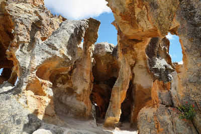 Weathered sandstone pillars and sculpted rock formations inside Stadsaal Caves in the Cederberg Wilderness Area, Western Cape, South Africa.