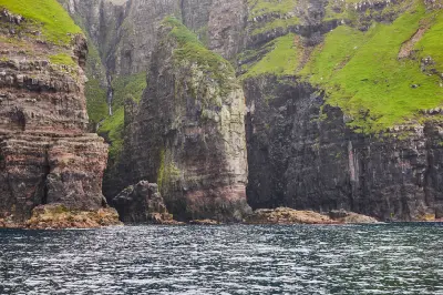 Layered basalt cliffs and freestanding rock formation along the Vestmanna bird cliffs, Streymoy, Faroe Islands.