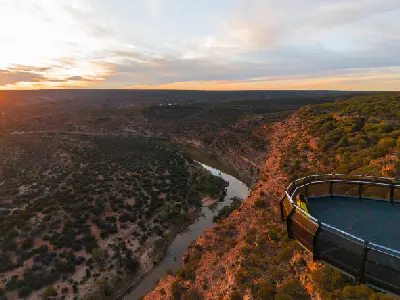 Kalbarri Skywalk extends over the Murchison River gorge in warm sunset light.