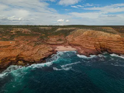 Layered sandstone cliffs meet the Indian Ocean at Pot Alley on the rugged Kalbarri coast.