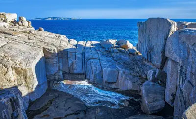 Natural Bridge above surging ocean water in Torndirrup National Park near Albany, Western Australia.