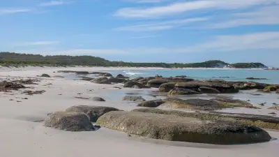 White-sand beach and granite boulders looking north from Eddystone Point, Tasmania.