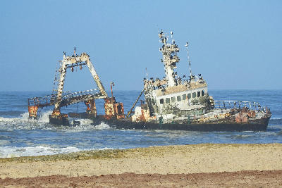 Close view of the Zeila shipwreck tilted in shallow Atlantic waters along Namibia’s Skeleton Coast near Henties Bay.