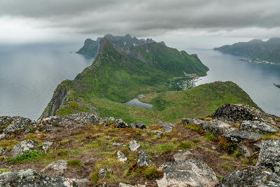 Rocky summit view from Hesten looking toward Segla ridge with fjords on either side