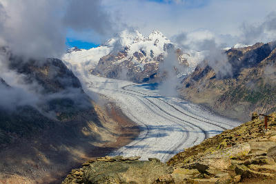 Great Aletsch Glacier viewed from near Eggishorn, with cloud drifting across the glacier and surrounding alpine peaks.