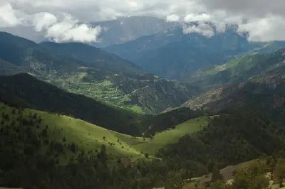 View across the green valleys and forested slopes of the Zigana Mountains beneath low clouds near Trabzon, Turkey.