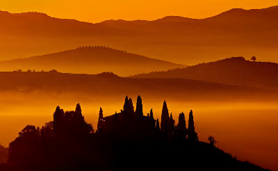 An Amazing panoramic photo of the golden hour in Podere Belvedere, Tuscany, Italy.