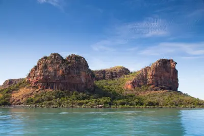 Rugged sandstone cliffs rise above the turquoise waters of the Hunter River in the remote Kimberley.